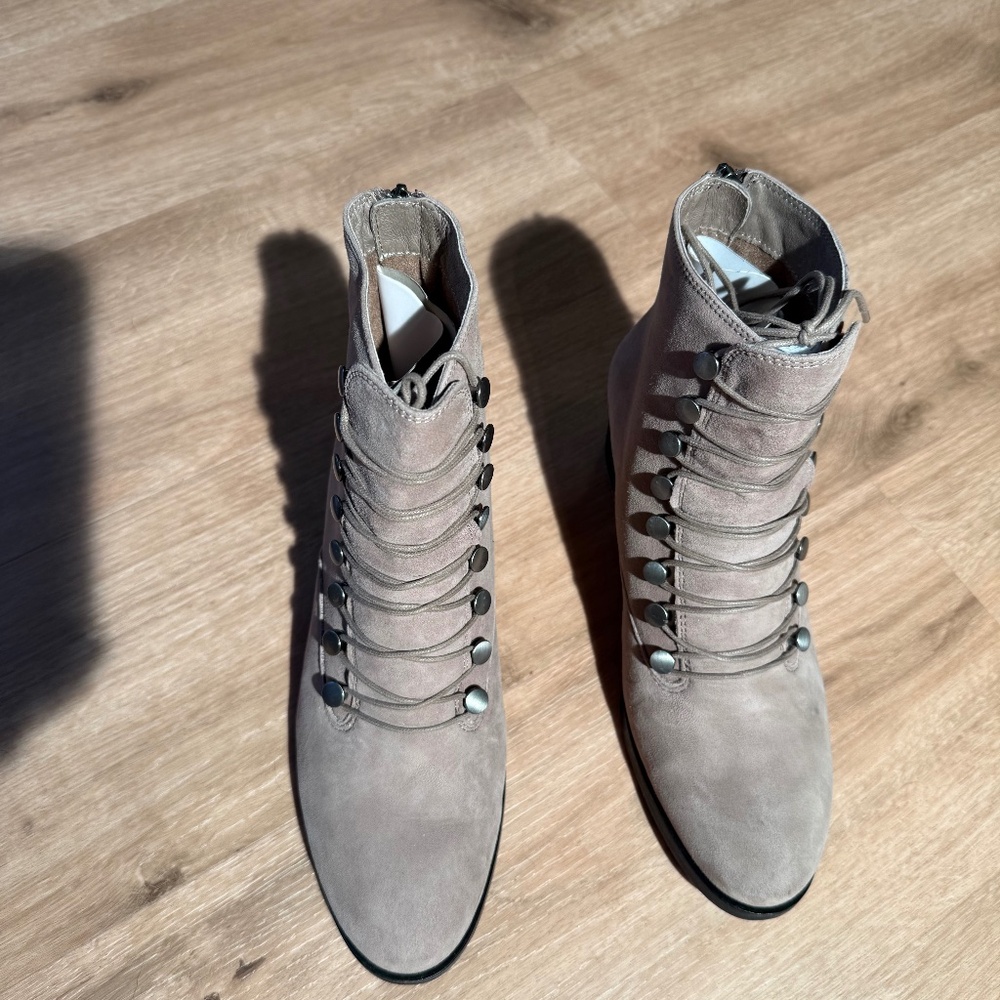 Lace up, side-zip suede boots with removable insole.
